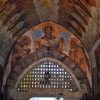 Srednjovekovna freska Bogorodice iznad kamenog luka na ulazu u manastir Zica sa vidljivim tragovima vremena